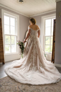 An Elegant Brides bride in her wedding dress and wedding accessories on her wedding day.