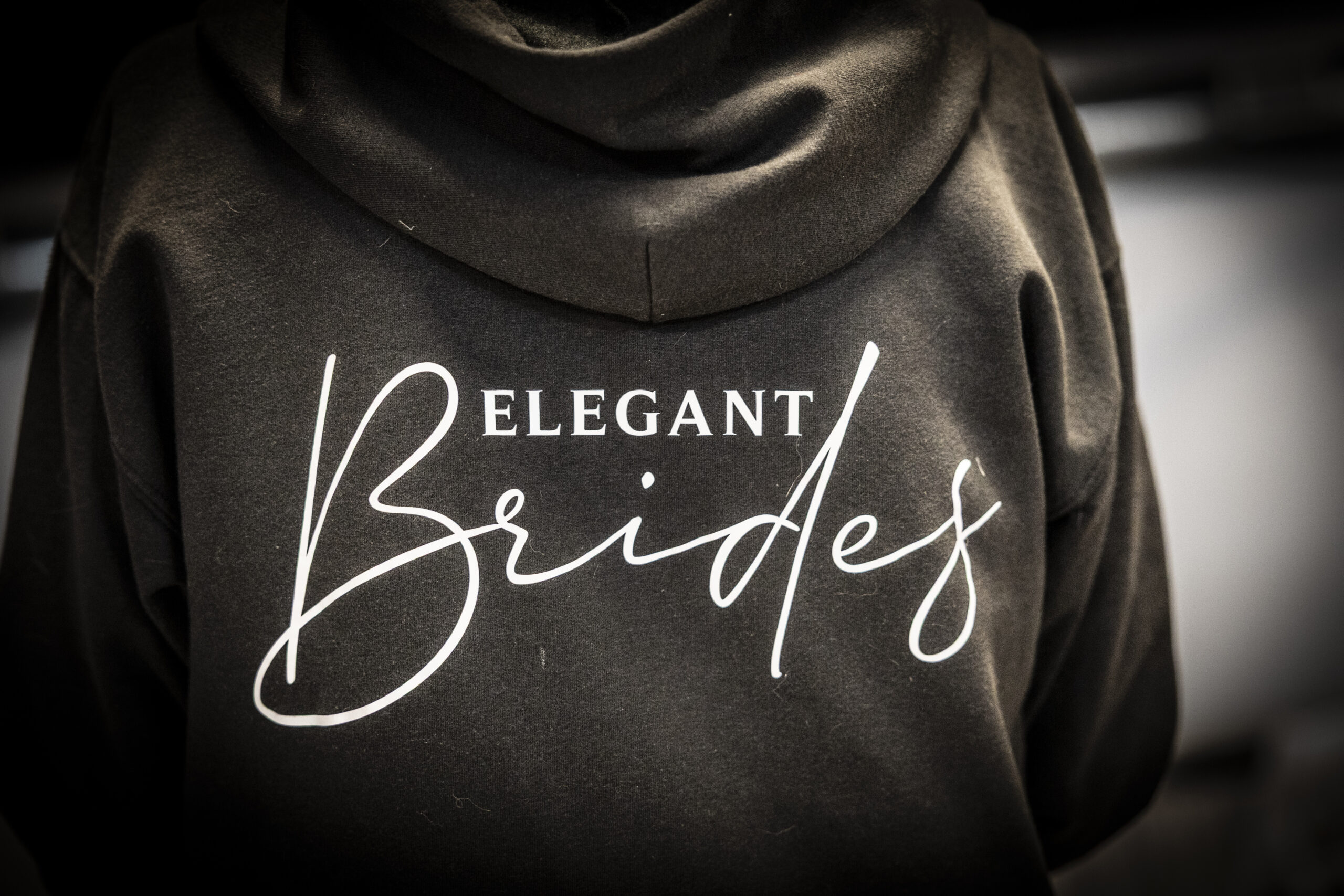 Hooded satin robe with the Elegant Brides logo.