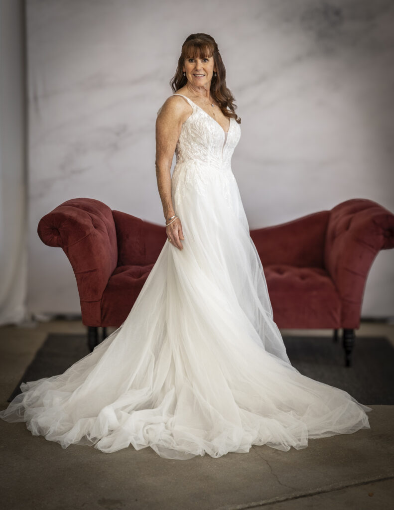 Rebecca Ingram's Valerie wedding dress, featuring intricate beadwork across the bodice and a full tulle skirt.