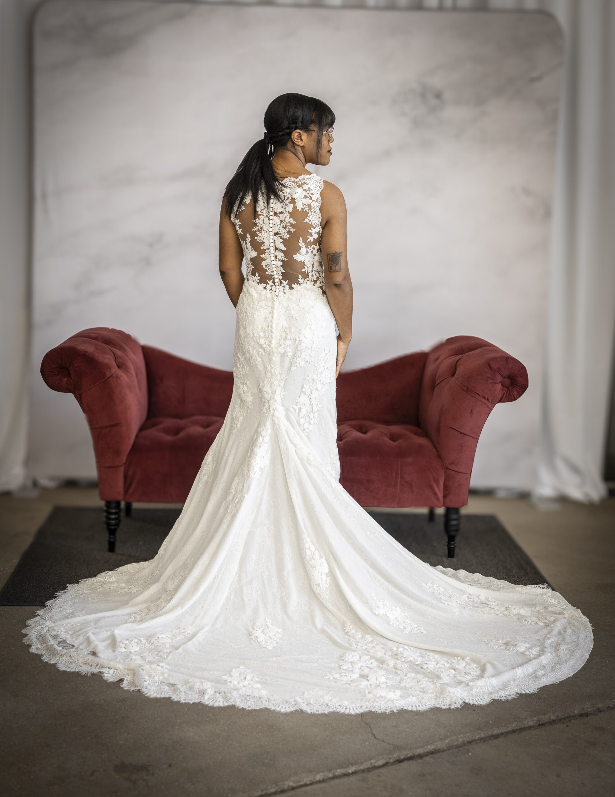 An Elegant Bride wearing a romantic lace wedding dress, 6933 by Stella York.